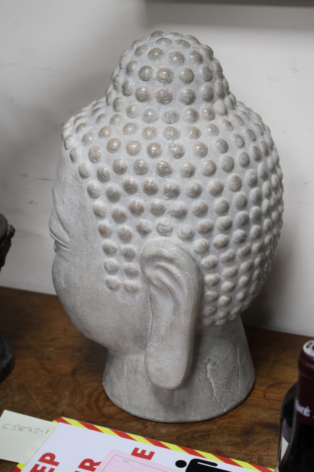 A Far Eastern ceramic Buddha head, height 44cm